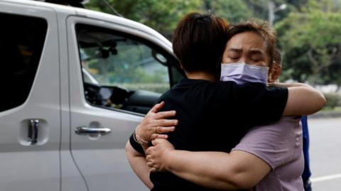 Two women embrace after an earthquake hit Taiwan