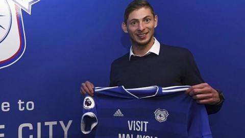 Emiliano Sala posing with a Cardiff City shirt on 20 January