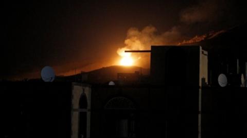 An explosion at a military arms depot is seen after it was hit by a Saudi-led air strike on the Nuqom Mountain overlooking Yemen's capital Sanaa (14 October 2016)