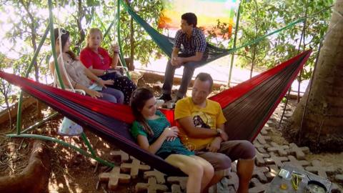 People relax in hammocks outside of Cuba Libro.