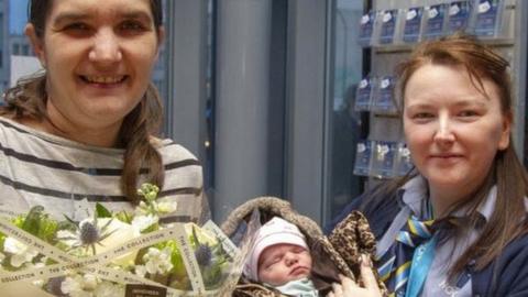 (L-R) Mother Katie Cauldwell, Rebecca Hall who delivered the baby, Destinie, and Tim Taylor of South Yorkshire Passenger Transport Executive