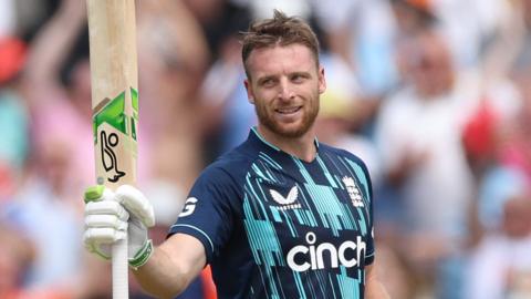 Jos Buttler raises his bat to the crowd after hitting a century against the Netherlands