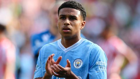 Shea Charles applauds the Manchester City fans after the 1-0 defeat by Brentford