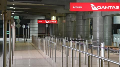 A deserted Qantas domestic arrivals terminal in Sydney, Australia.