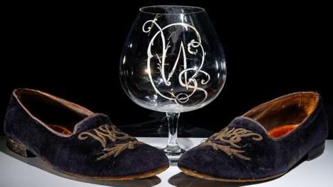 The slippers and the brandy glass