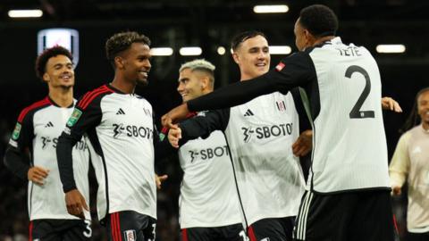 Fulham players celebrate winning penalty shootout