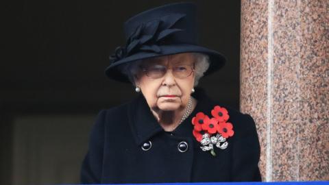 The Queen watching the service