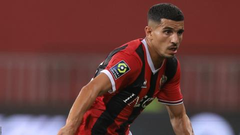 Youcef Atal running while playing for Nice