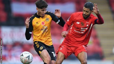 Newport's Jamie Devitt battles for possession with Leyton Orient veteran Jobi McAnuff