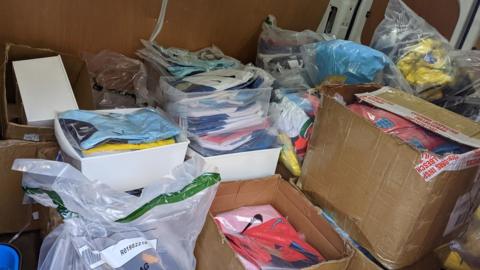 Fake football kits stored in boxes, found by Newcastle City Council trading standards officers