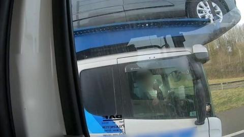 Driver using elbow to steer cab