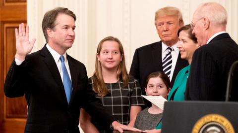 Brett Kavanaugh (L) is sworn-in as Associate Justice of the US Supreme Court by Associate Justice Anthony Kennedy