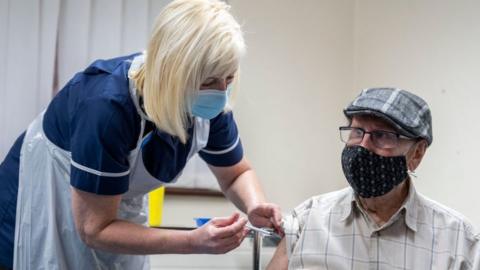 One of the early people to get a first dose of a vaccine in Merthyr Tydfil