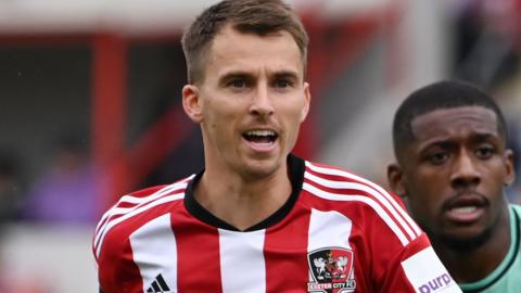 Tom Carroll in action for Exeter City