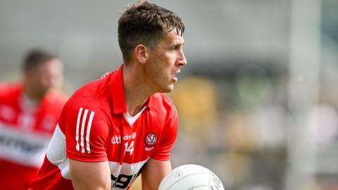 Derry forward Shane McGuigan in action against Donegal