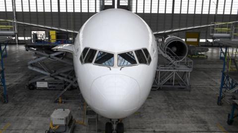 A Boeing 777-300 ER in maintenance.