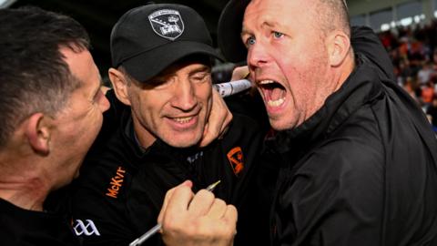 Kieran McGeeney and Ciaran McKeever celebrate after Armagh's dramatic win over Galway