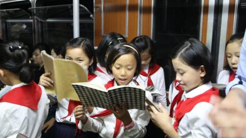 Young children in a subway carriage