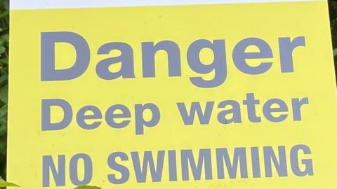Deep water - no swimming sign