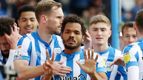 Duane Holmes celebrates scoring for Huddersfield against Hull City