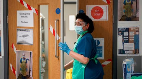 Nurse enters a Covid zone in a hospital