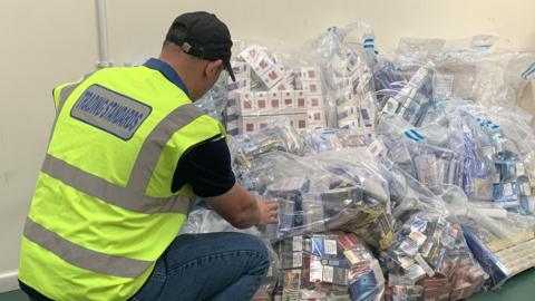 Trading Standards officer with haul of illegal cigarettes