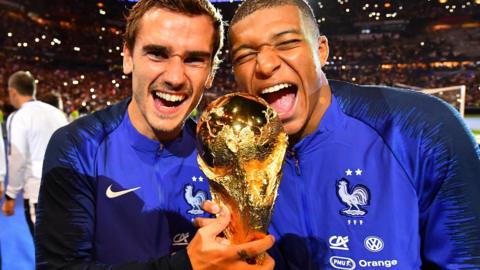 Kylian Mbappe and Antoine Griezmann celebrate winning the 2018 World Cup