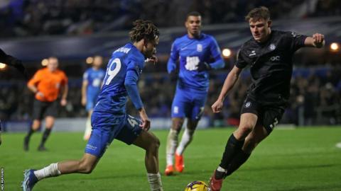 Romelle Donovan (left) challenges for the ball for Birmingham