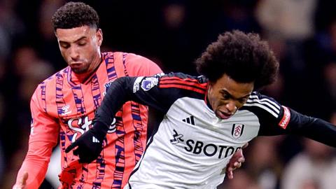 Ben Godfrey (L) of Everton and Willian challenge for the ball during the Premier League match between Fulham FC and Everton FC at Craven Cottage on January 30, 2024 in London, England