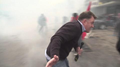 ý correspondent Martin Patience flees tear gas