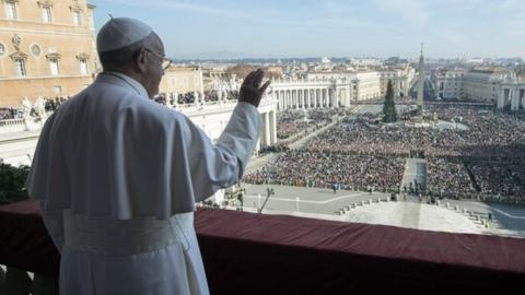 Pope Francis standing on a balcony of St Peter"s basilica during the traditional "Urbi et Orbi"