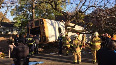 handout photo provided by the Chattanooga Fire Department (CFD) shows emergency responders at the scene of a school bus crash in Chattanooga, Tennessee, USA, 21 November 2016.