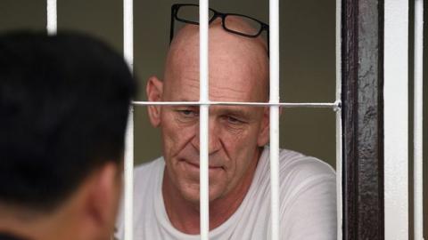 Former British war correspondent David Fox inside a holding cell