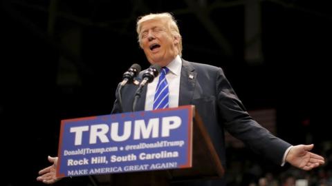 Donald Trump welcomes applause during a rally in South Carolina.