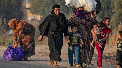 Civilians flee bombardment in Ras al-Ain, 9 October