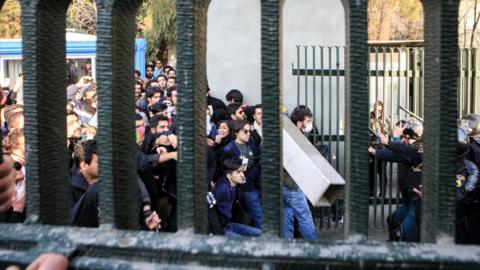 Iranian students clash with riot police during demonstrations against the regime, Tehran, 30 Dec 2017