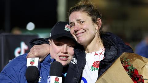Sarah Hunter cries as she hugs England team-mate Hannah Botterman