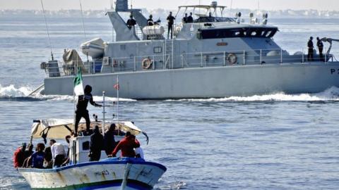 Tunisian Croissant Sportif Chebbien (CSC) football fans, who have threatened for weeks to emigrate to Italy in protest over sanctions against their club, board fishing boats on November 12, 2020 in the Mediterranean port of Chebba, accompanied by the Tunisian coast guard.