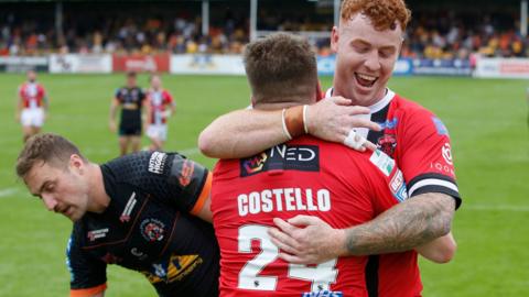 Salford's Matt Costello celebrates with Harvey Livett after scoring a try