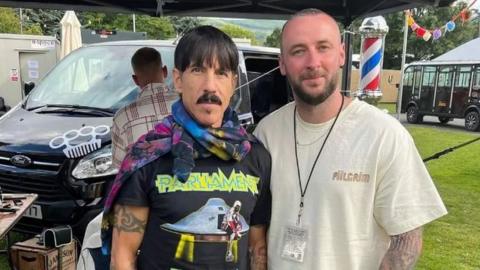 Anthony Kiedis pictured with Greg McNeil from Bareknuckle Barebershop