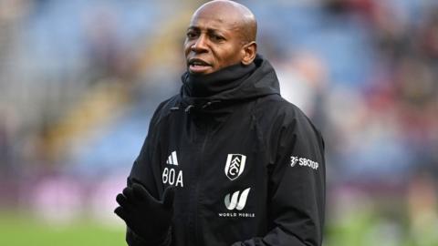Luis Boa Morte in black and white training kit of Premier League side Fulham claps his hands