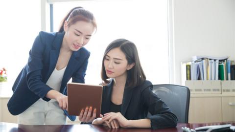 female workers in suits