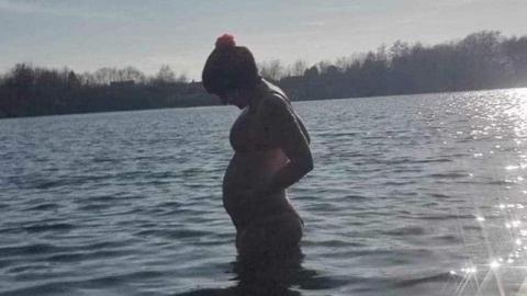Kellie Pyart, pregnant, standing in water