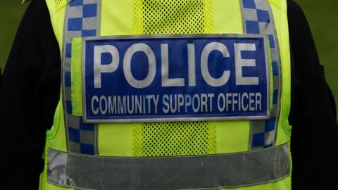 Close-up of police community support officer jacket