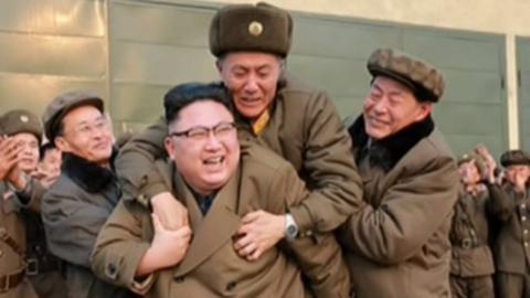 Picture of Kim Jong-un piggybacking a military officer in a photo released on 19 March 2017