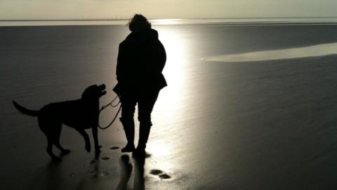 anonymous woman on beach