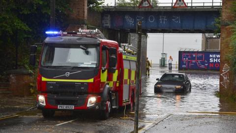 car stuck in floodwater