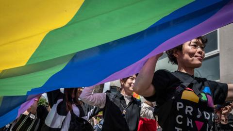 People attend the Tokyo Rainbow Pride 2023 Parade in Tokyo on April 23, 2023, to show support for members of the LGBT community