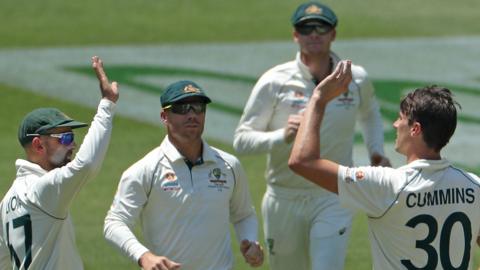 Pat Cummins celebrates taking a New Zealand wicket