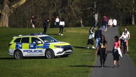 A police car patrolling Greenwich Park in London in April